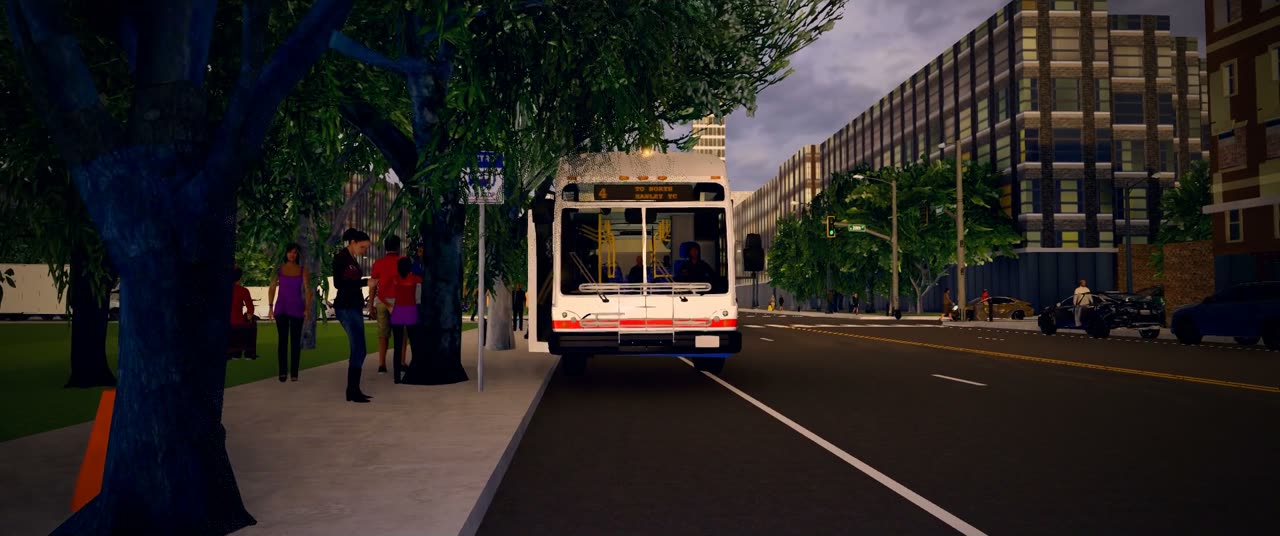 A Metro bus pulling in to a stop where people wait